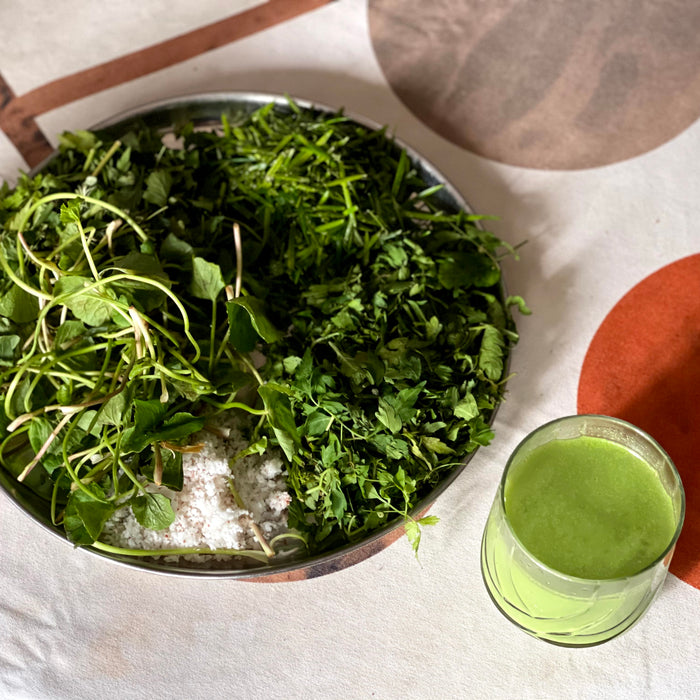 Kola Kanda beverage with a coconut, moringa, and gotukola