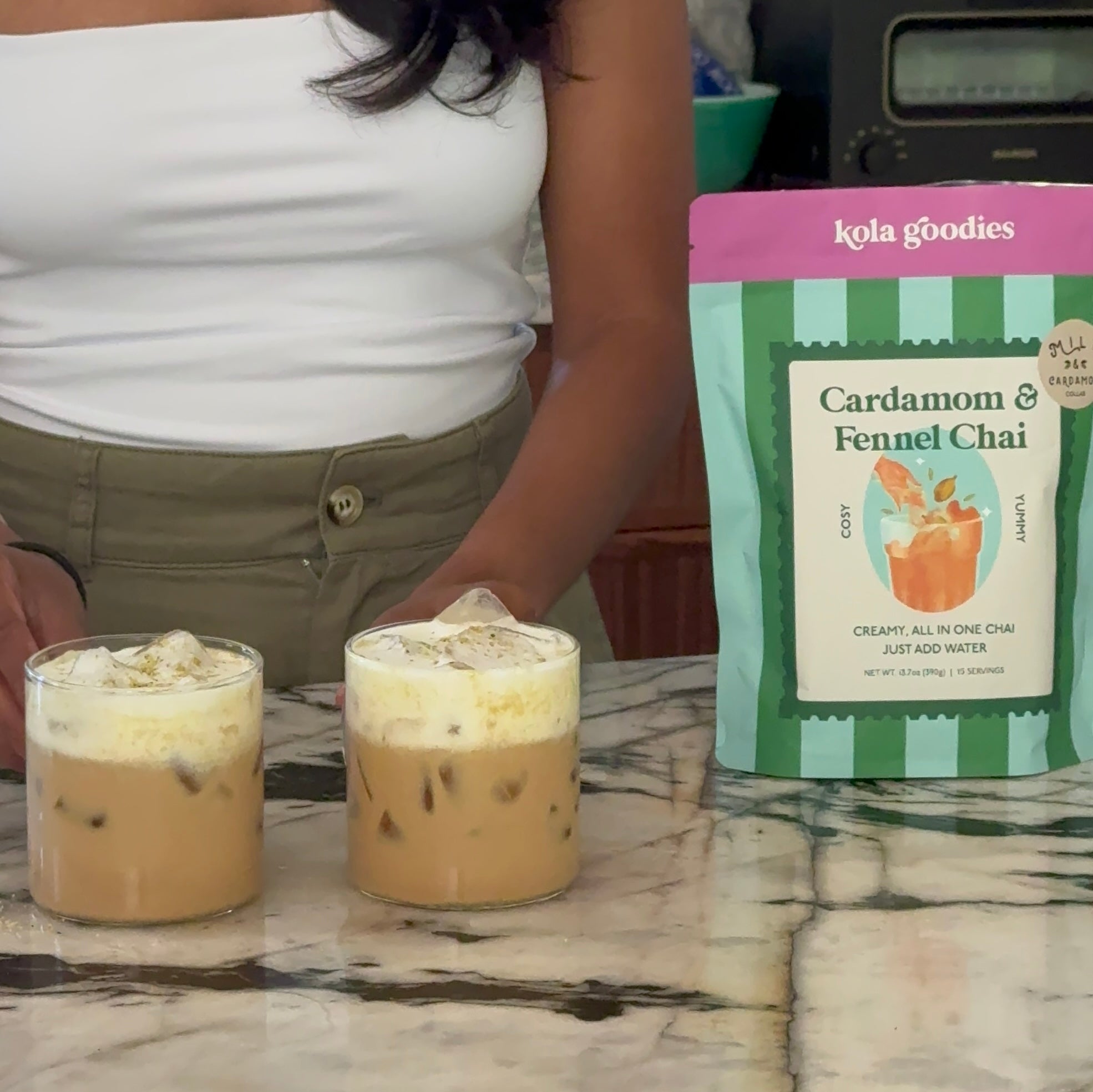 cardamom fennel chai with two cups of iced chai with cold foam