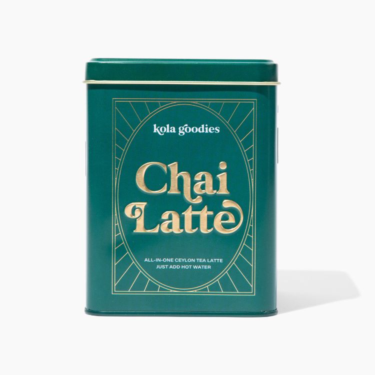 A green tin labeled 'Chai Latte' from Kola Goodies, containing tea mix and spices for making latte.