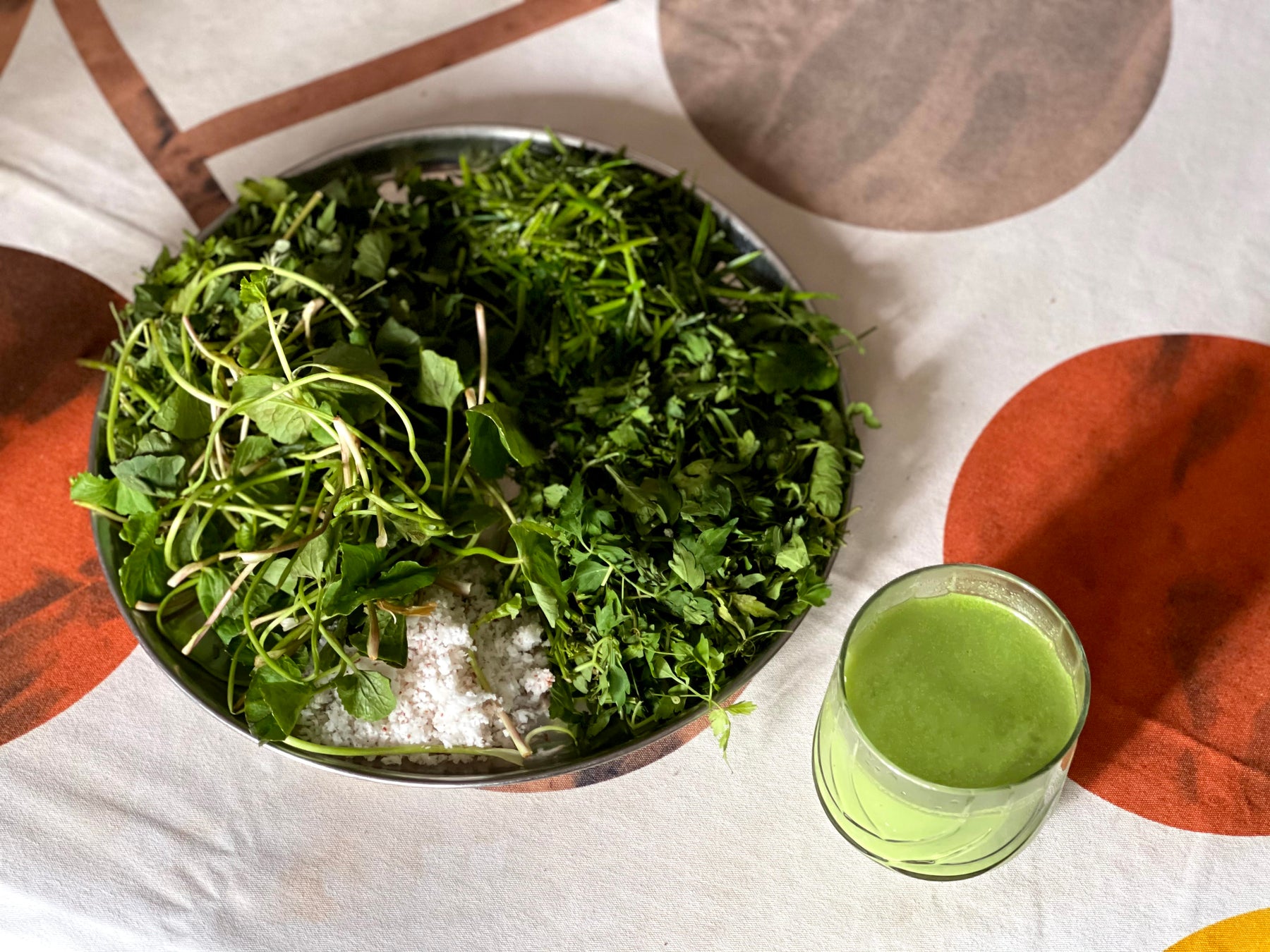 Kola Kanda beverage with a coconut, moringa, and gotukola